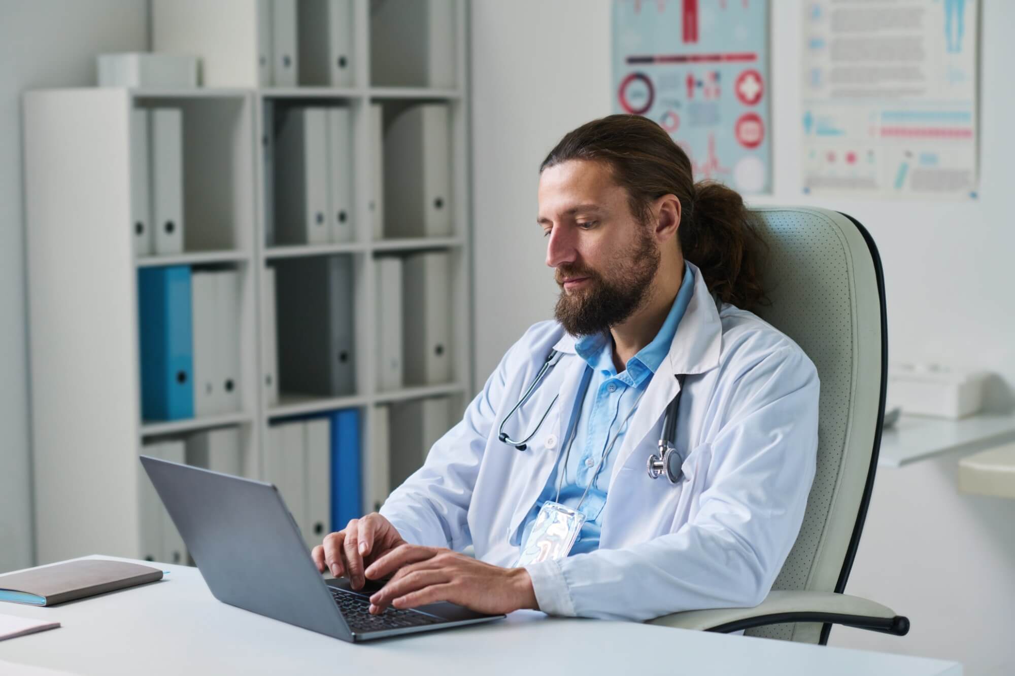 young serious doctor typing on laptop keyboard whi 2025 03 16 09 12 58 utc.jpg